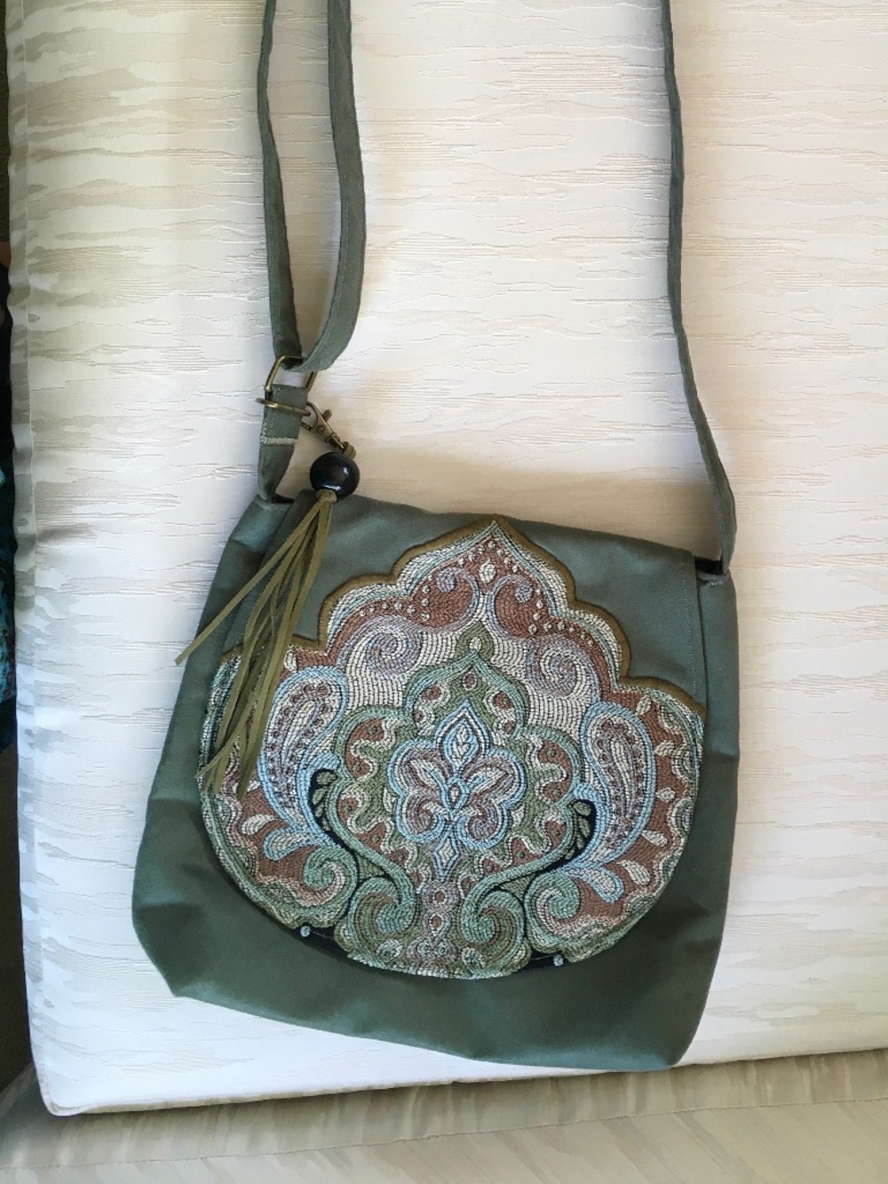 Crossbody faux suede moss green bag with tassle